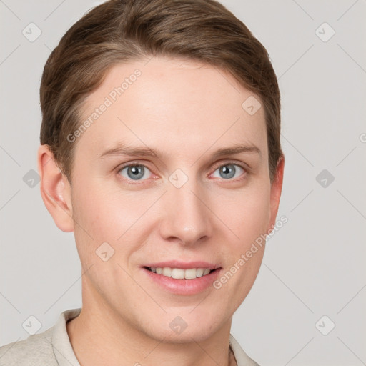 Joyful white young-adult female with short  brown hair and grey eyes