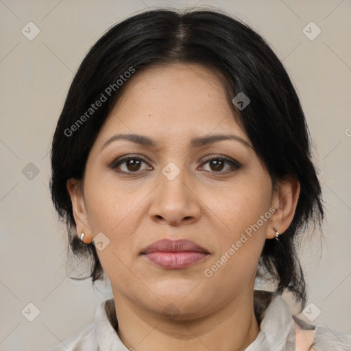 Joyful latino adult female with medium  brown hair and brown eyes