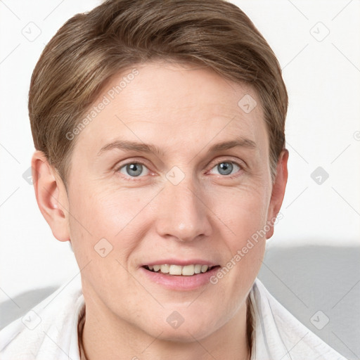 Joyful white young-adult female with short  brown hair and grey eyes