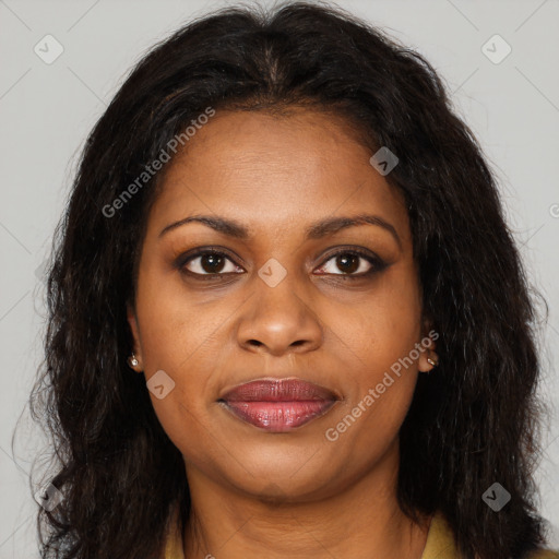 Joyful black young-adult female with long  brown hair and brown eyes