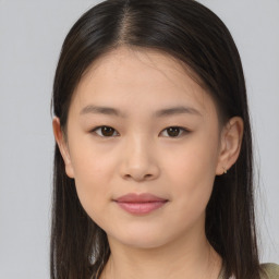 Joyful asian young-adult female with long  brown hair and brown eyes