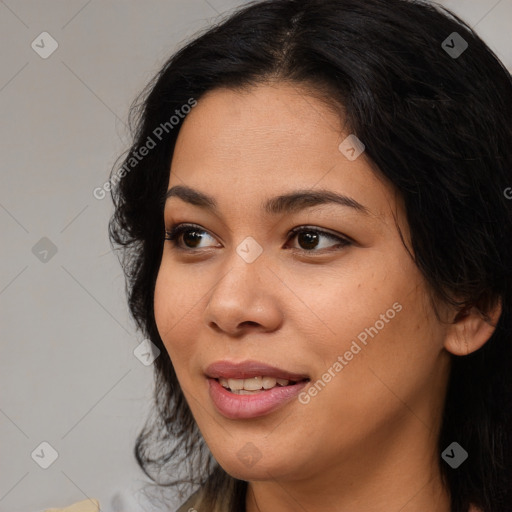 Joyful asian young-adult female with long  brown hair and brown eyes