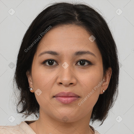 Joyful latino young-adult female with medium  brown hair and brown eyes