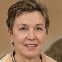 Joyful white middle-aged female with short  brown hair and brown eyes