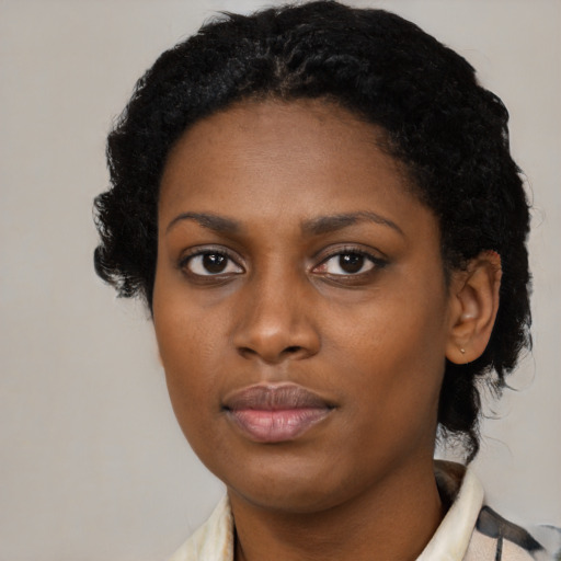 Neutral black young-adult female with medium  black hair and brown eyes