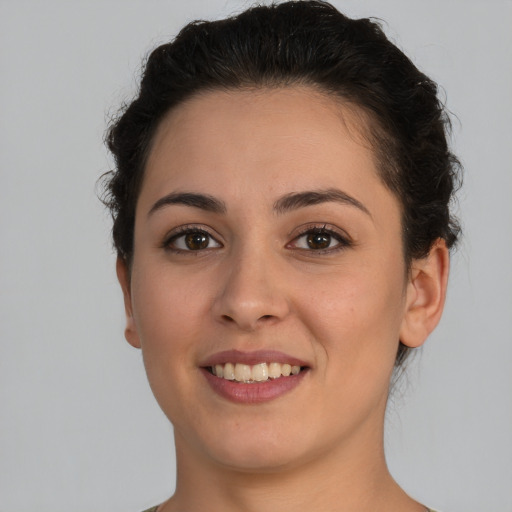 Joyful white young-adult female with short  brown hair and brown eyes