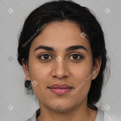 Joyful latino young-adult female with medium  brown hair and brown eyes