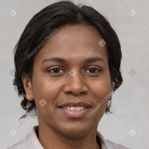 Joyful latino adult female with short  brown hair and brown eyes