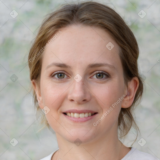 Joyful white young-adult female with medium  brown hair and blue eyes