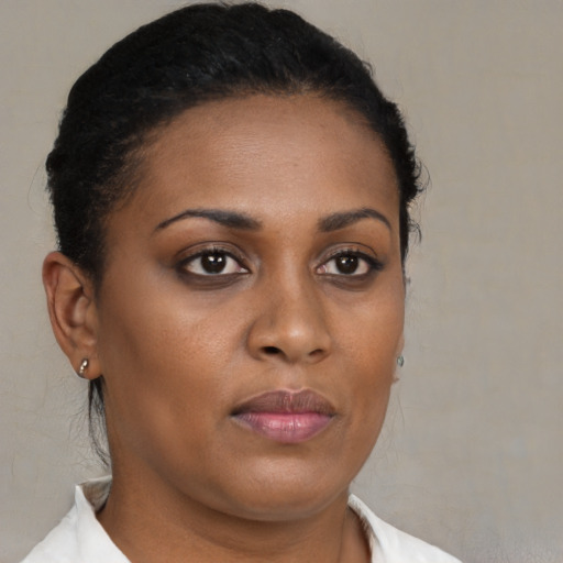 Neutral black young-adult female with short  brown hair and brown eyes