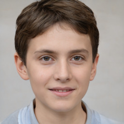 Joyful white child male with short  brown hair and brown eyes