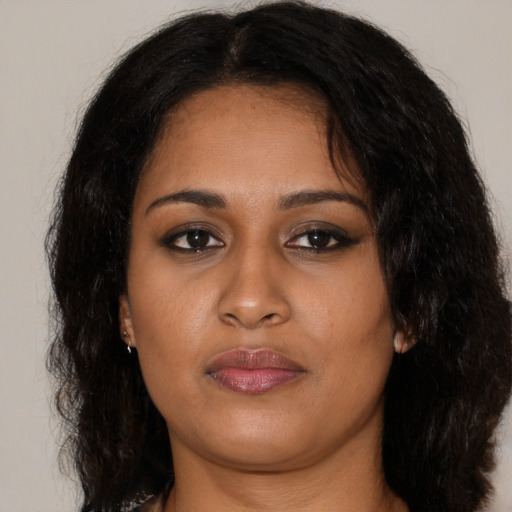 Neutral black young-adult female with long  brown hair and brown eyes
