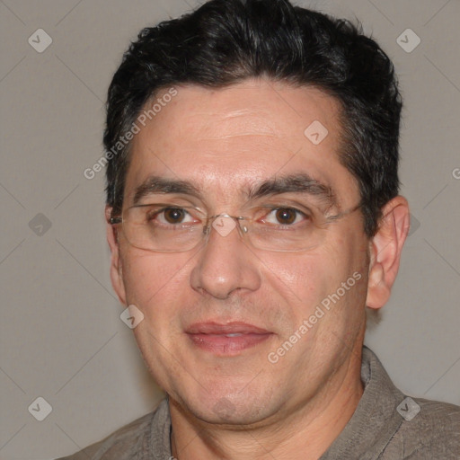 Joyful white adult male with short  black hair and brown eyes