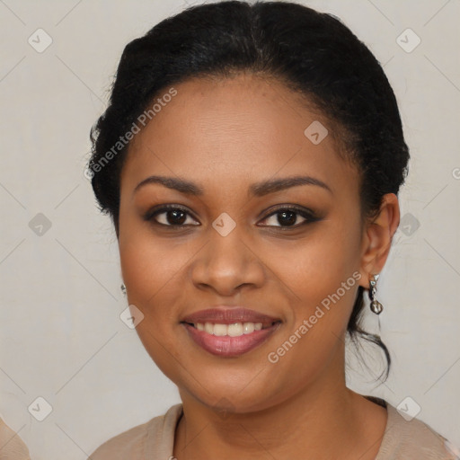 Joyful black young-adult female with long  brown hair and brown eyes