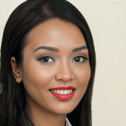 Joyful latino young-adult female with long  black hair and brown eyes