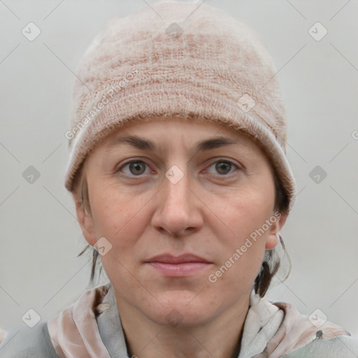 Joyful white adult female with short  brown hair and grey eyes