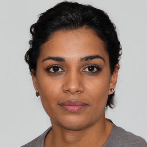 Neutral latino young-adult female with short  black hair and brown eyes