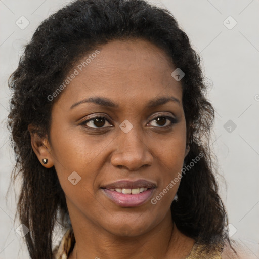 Joyful black adult female with medium  brown hair and brown eyes
