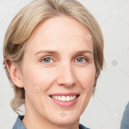 Joyful white adult female with medium  brown hair and blue eyes