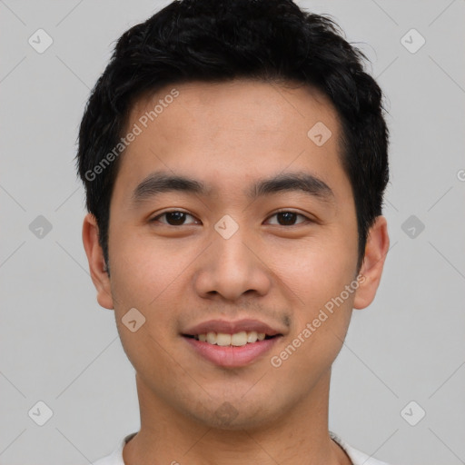 Joyful asian young-adult male with short  black hair and brown eyes