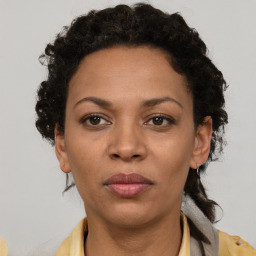 Neutral black adult female with short  brown hair and brown eyes