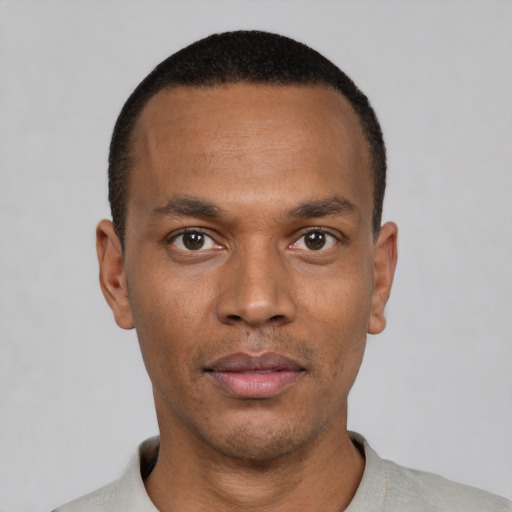 Neutral black young-adult male with short  black hair and brown eyes