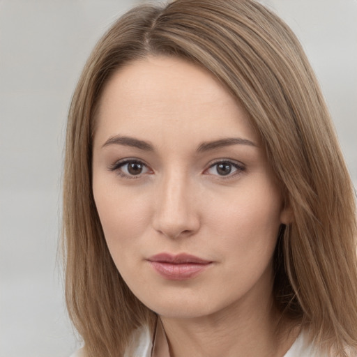 Neutral white young-adult female with long  brown hair and brown eyes