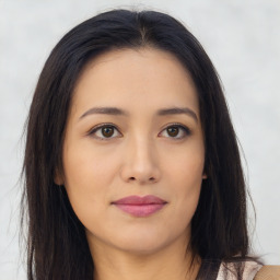 Joyful asian young-adult female with long  brown hair and brown eyes