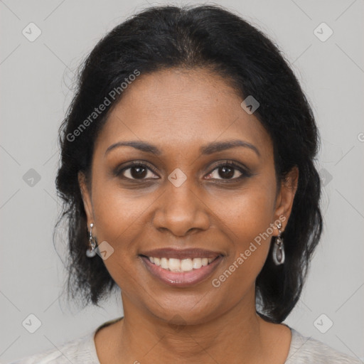 Joyful black young-adult female with medium  brown hair and brown eyes