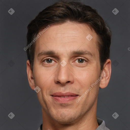 Joyful white adult male with short  brown hair and brown eyes