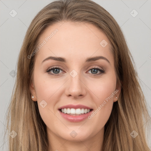 Joyful white young-adult female with long  brown hair and grey eyes