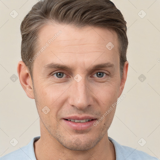 Joyful white adult male with short  brown hair and grey eyes