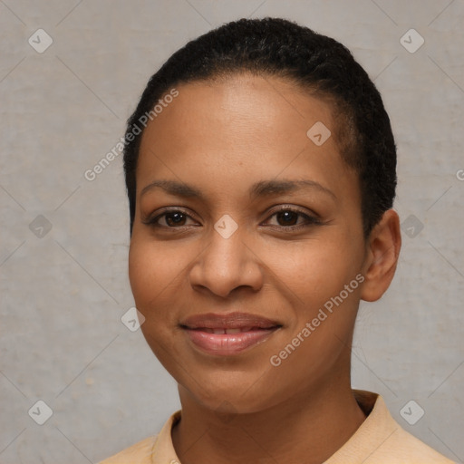 Joyful black young-adult female with short  black hair and brown eyes