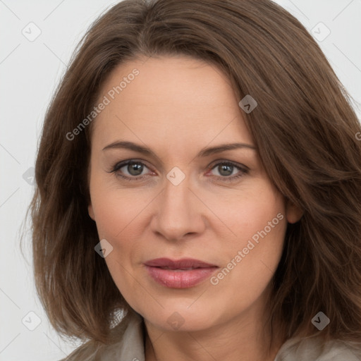 Joyful white adult female with long  brown hair and brown eyes