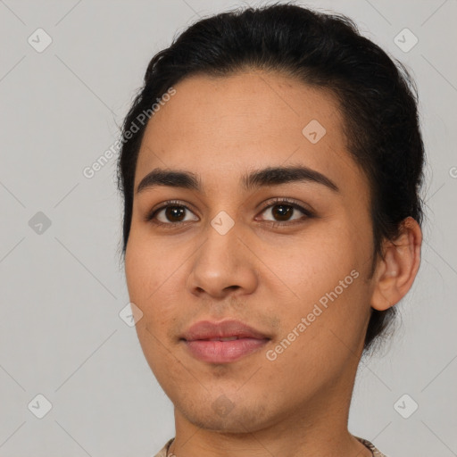 Joyful latino young-adult female with short  brown hair and brown eyes