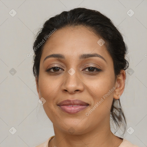 Joyful latino young-adult female with medium  brown hair and brown eyes