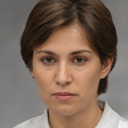 Neutral white young-adult female with medium  brown hair and brown eyes