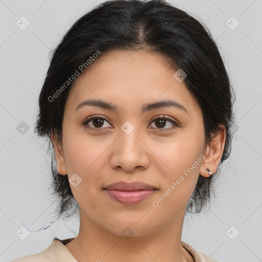 Joyful latino young-adult female with medium  brown hair and brown eyes