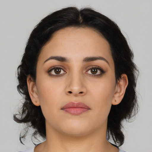 Neutral latino young-adult female with medium  black hair and brown eyes