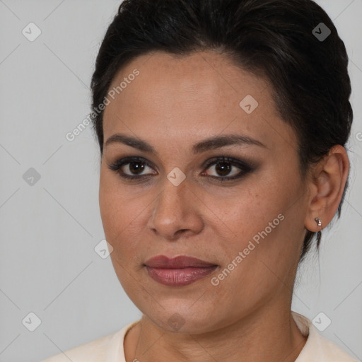 Joyful latino young-adult female with short  brown hair and brown eyes