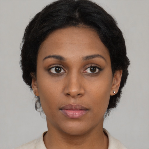 Neutral latino young-adult female with medium  brown hair and brown eyes