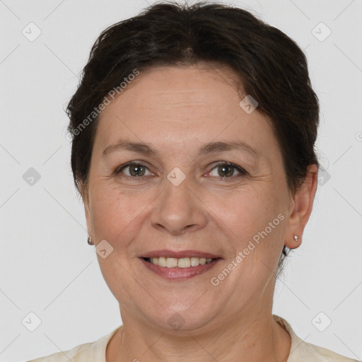 Joyful white adult female with short  brown hair and brown eyes