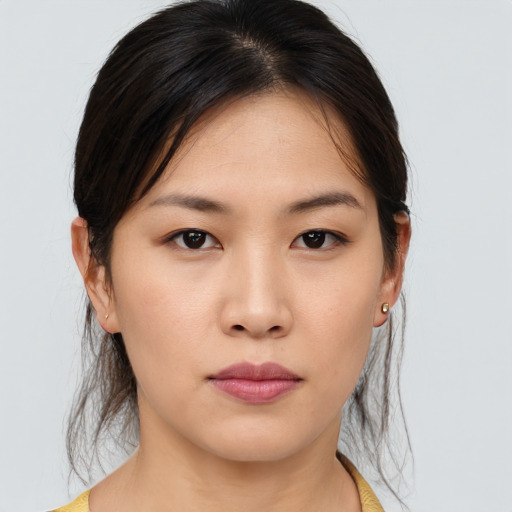 Neutral asian young-adult female with medium  brown hair and brown eyes