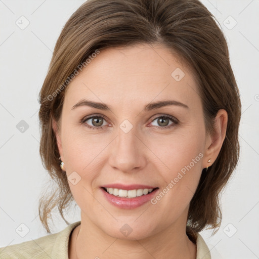 Joyful white young-adult female with medium  brown hair and grey eyes