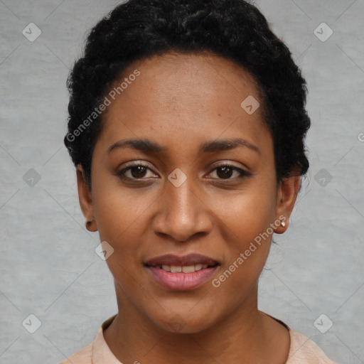 Joyful black young-adult female with short  black hair and brown eyes