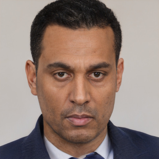 Neutral white adult male with short  black hair and brown eyes