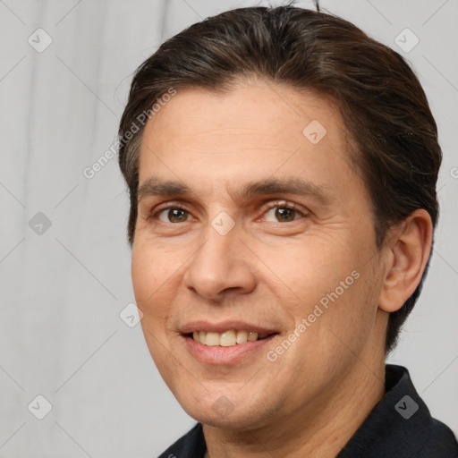 Joyful white adult male with short  brown hair and brown eyes