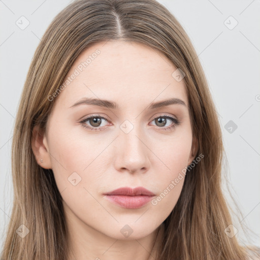 Neutral white young-adult female with long  brown hair and brown eyes