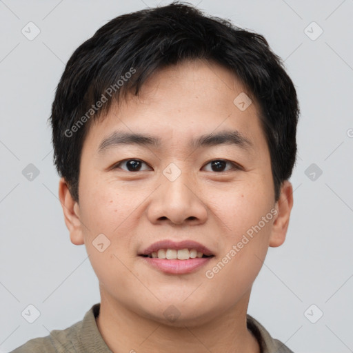 Joyful asian young-adult male with short  brown hair and brown eyes