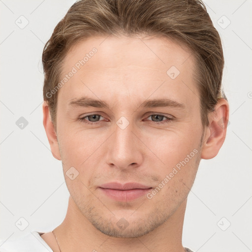 Joyful white young-adult male with short  brown hair and grey eyes